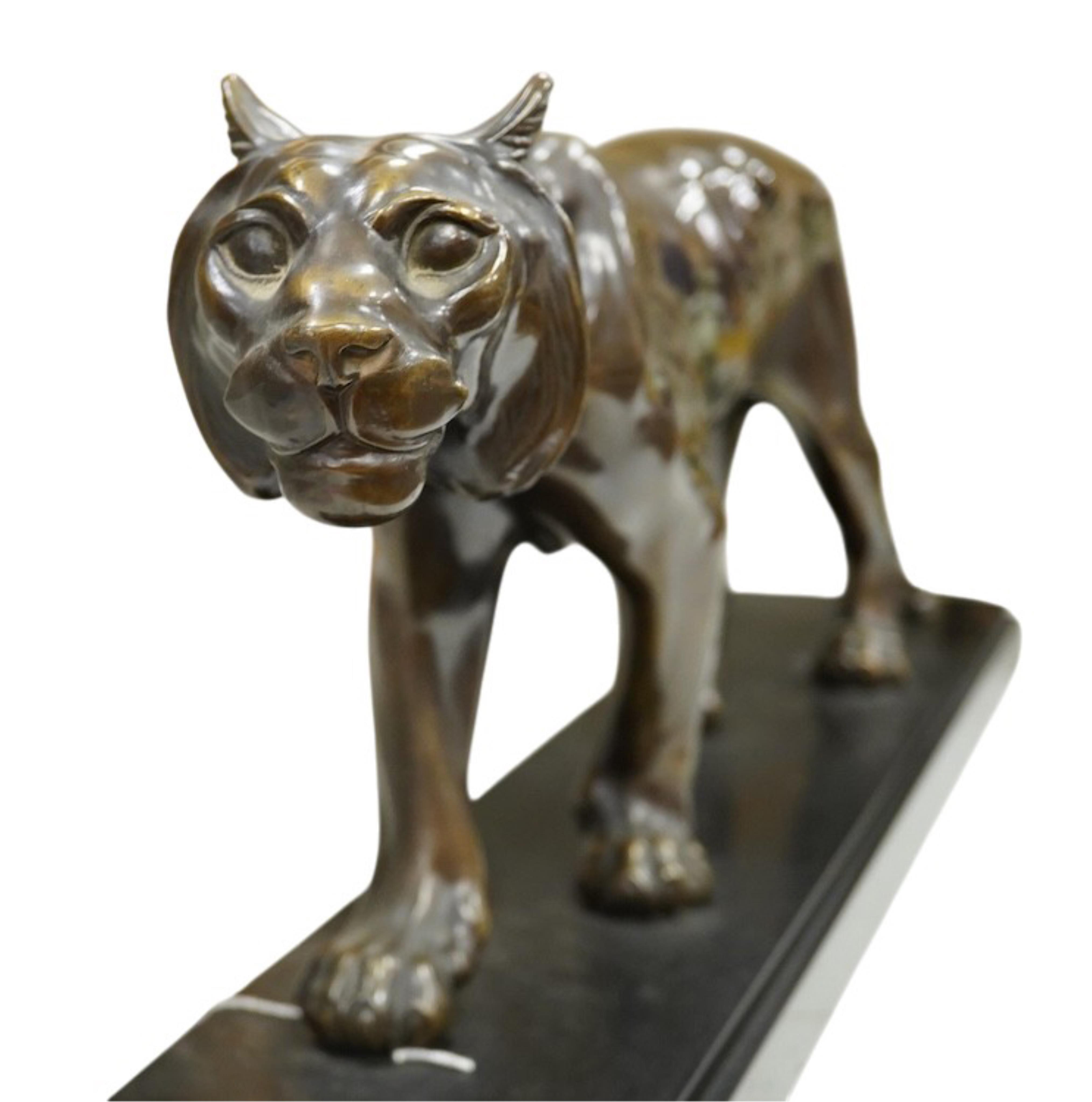 Manner of Maurice Font (19th/20th century): An Art Deco style bronzed spelter model of a tiger